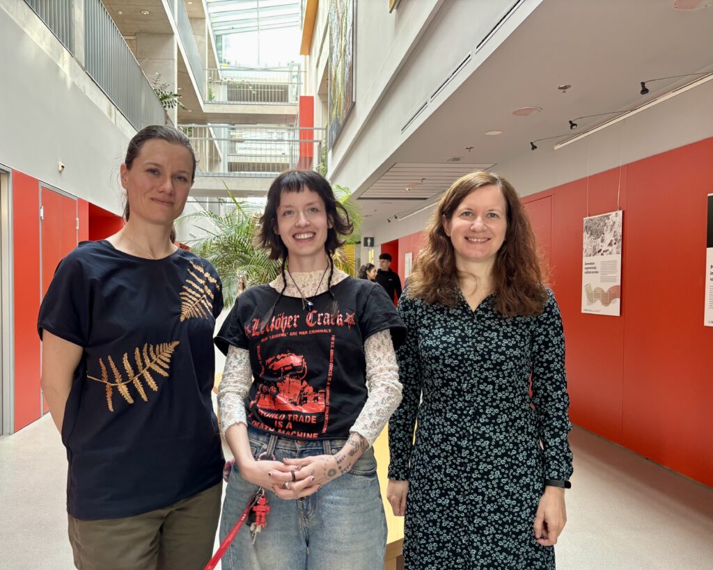 Dr Ajda Pretnar Žagar, Rebeka Kropivšek Leskovar and Tjaša Arčon in the main hallway at the Faculty of Computer and Information Science